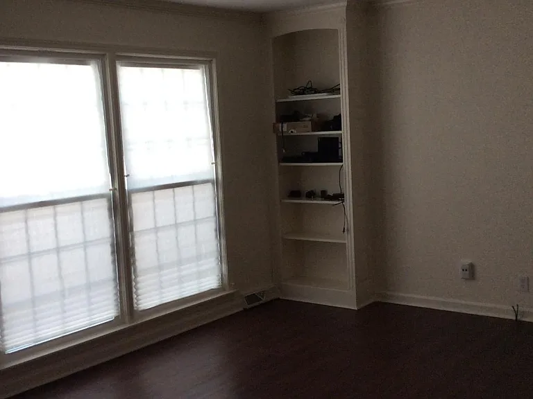 Built in bookcases in family room with lots of light