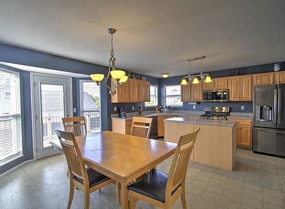 The newer upgraded appliances, gas range and eat in kitchen could not suit a large family better!