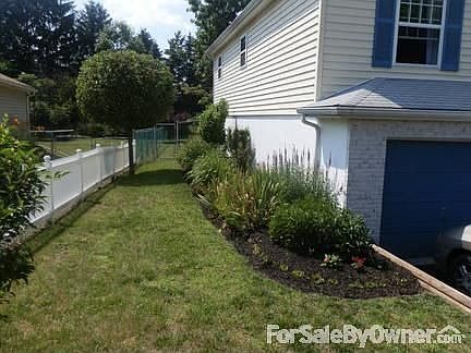 Landscaping
						:
						View is from the left of the house from the street.