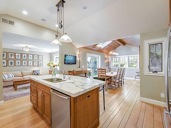 Kitchen with dining and sitting areas