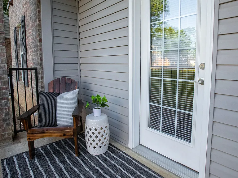 Step out to your private patio oasis, embellished with black wrought iron railing. It's a serene space perfect for a breath of fresh air.