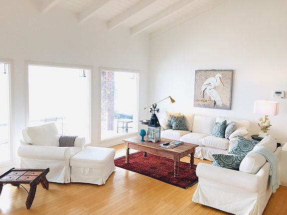 Open floor plan. First living room with beachey feel and amazing ocean views.