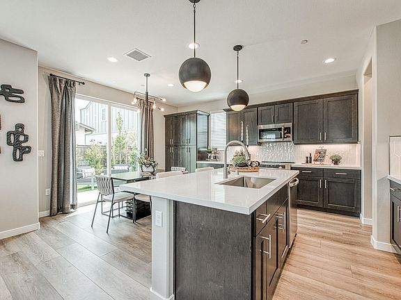 Open and airy Dining Kitchen with oversized Pantry cabinet