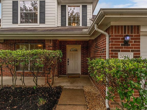 Charming front porch welcomes guests and is a great place to sit and enjoy an iced tea with a neighbor!
