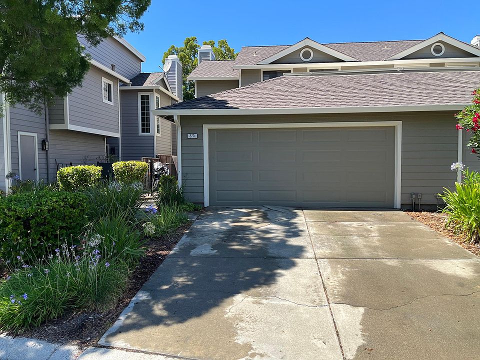 Street view. Home is a 'duet', one of two double story condos sharing a common wall. 20 foot driveway.