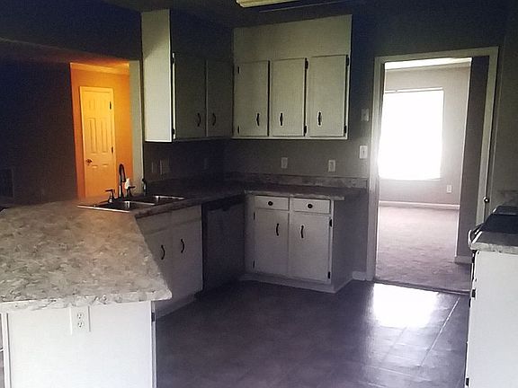 Kitchen flows to dining rm
