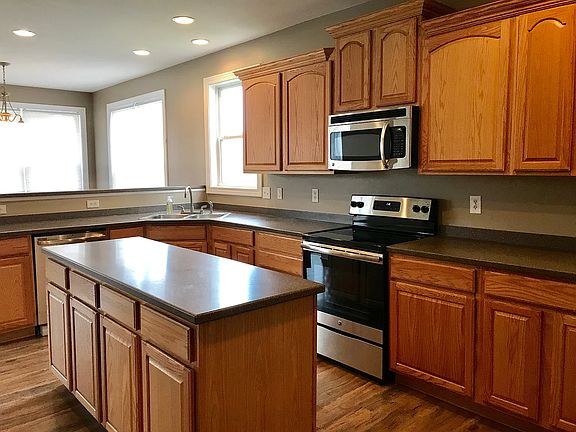 Kitchen with eat in bar area