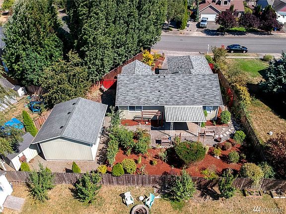 You'll be the envy of the neighborhood with the exquisite landscaping, shop and covered entertainment patio! So peaceful!