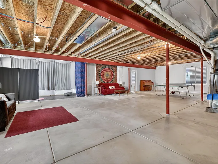 Large open basement. Ping pong table. Work out space. Piano