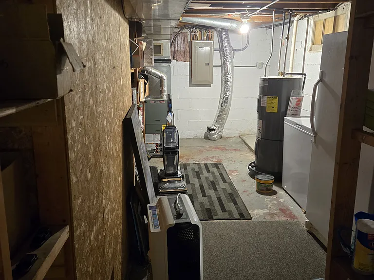 Utility space, extra storage, additional fridge, and chest freezer