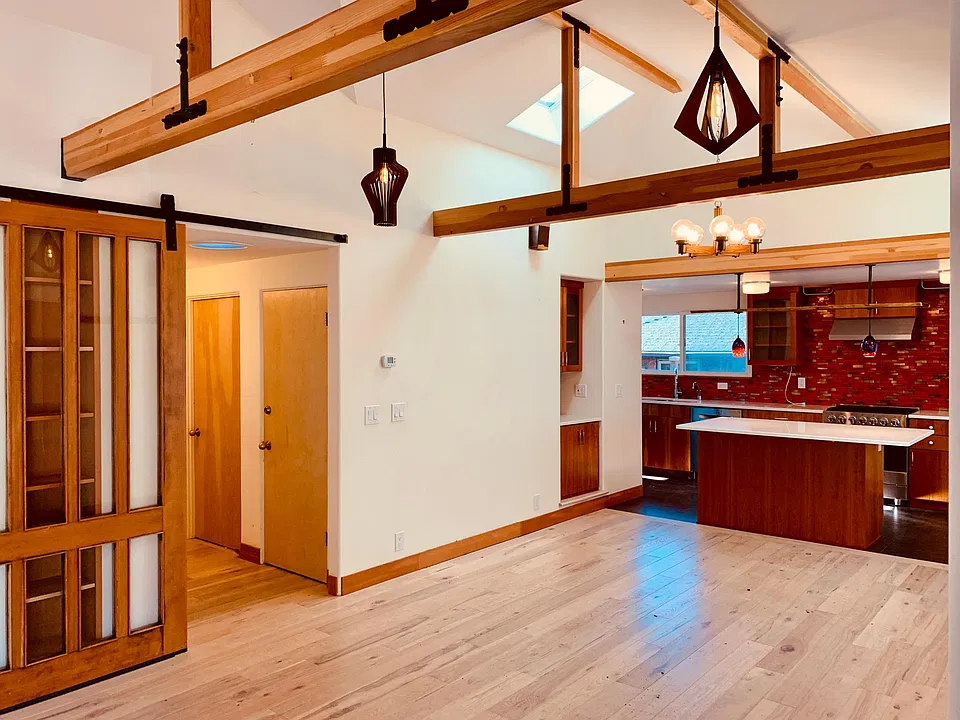Open kitchen with counter seating, built in bar, dining room. Super efficient and cozy heated radiant floors throughout. Fully remodeled in 2015 with mid-century restored touches and modern updates.