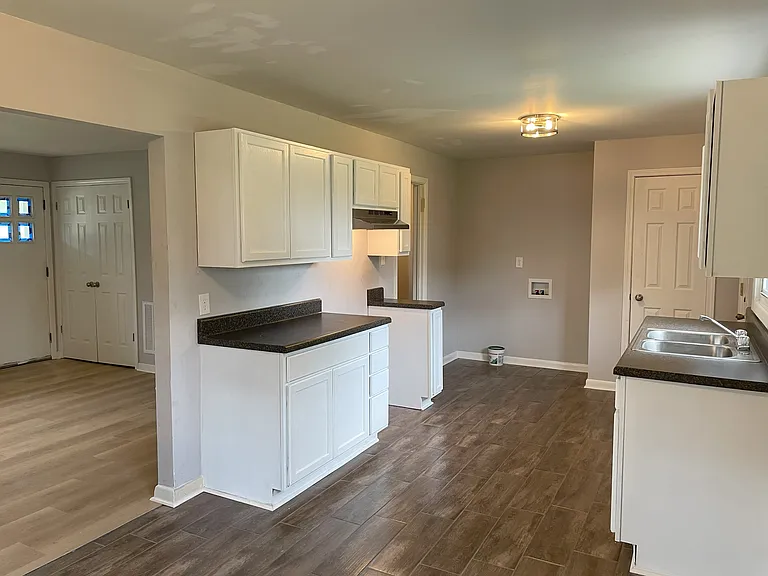 Ceramic Tile & LVP Flooring. Stainless Steel Refrigerator and Stove.