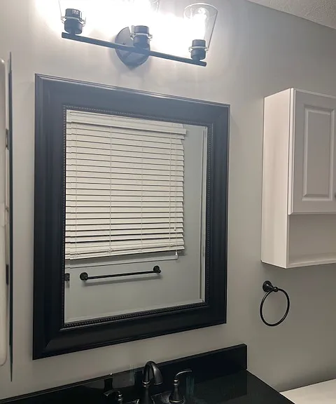 Primary Bathroom with newly updated light fixtures.