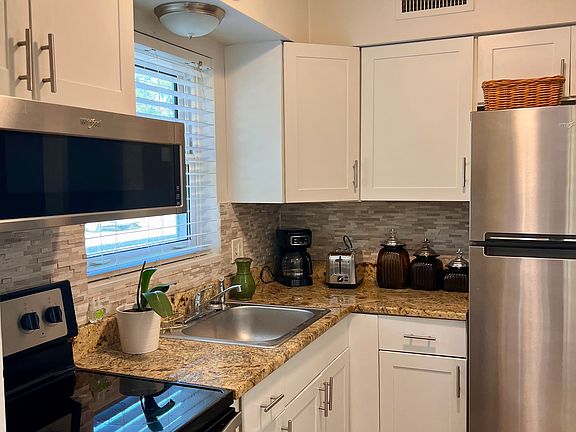 kitchen. Stainless steel appliances, granite countertops.