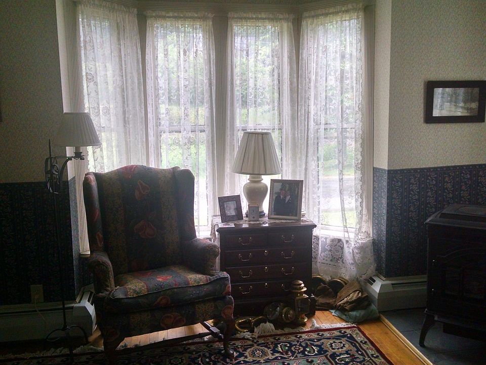Front living room with pellet stove and bay window