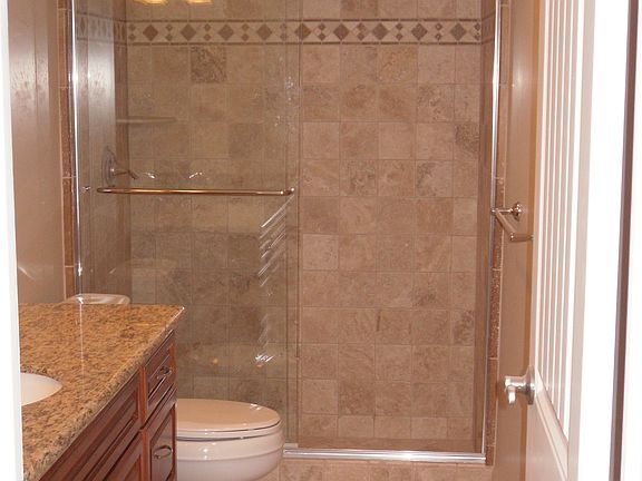 granite and travertine in both upgraded bathrooms