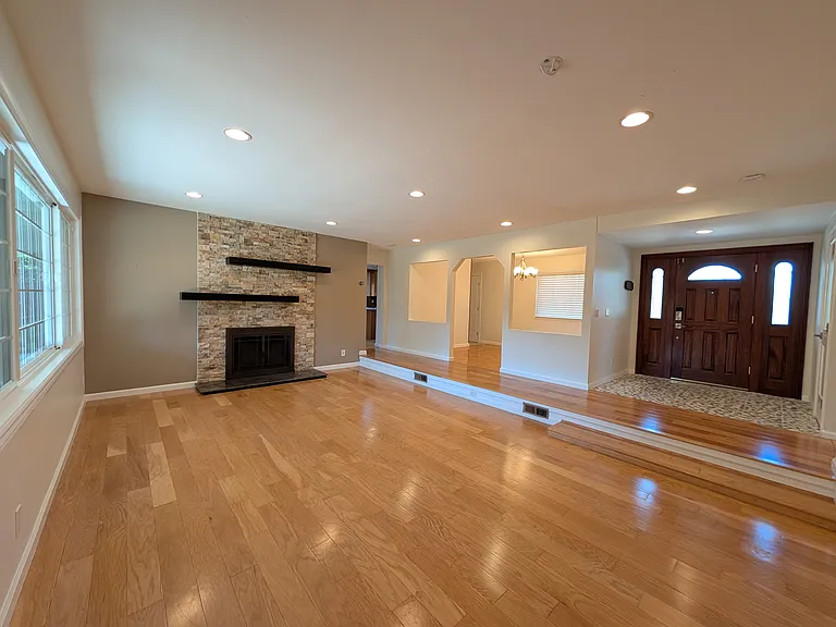 Living room facing dining room and kitchen.