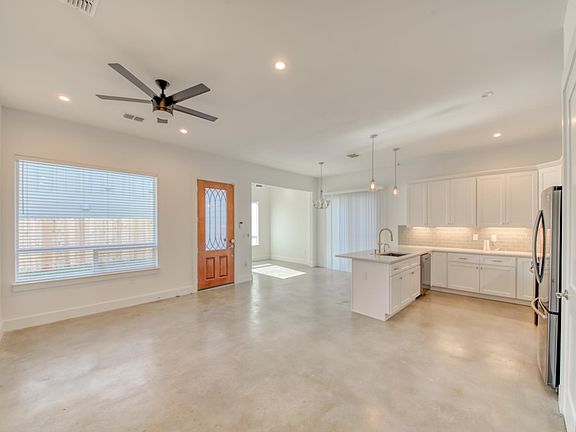 Wide view of living area, kitchen, dining area PLUS separate home office space! (Can also be used as a formal dining area!)