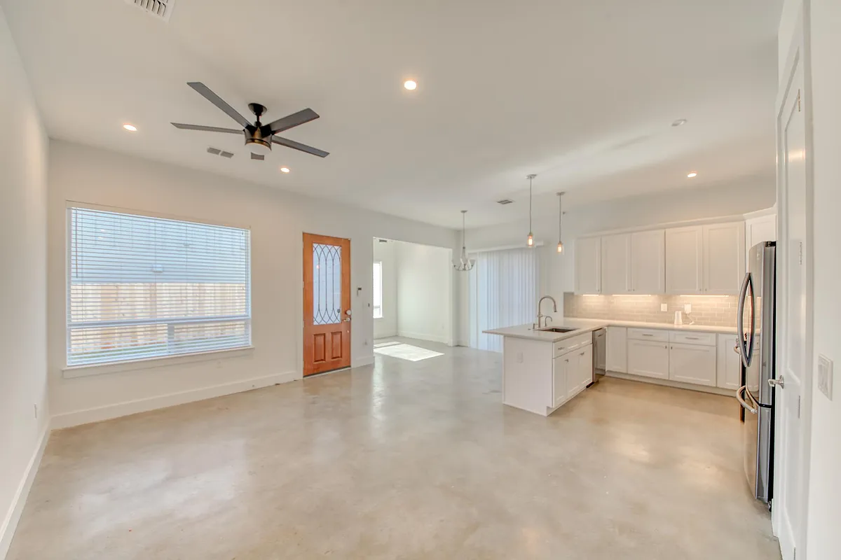 Wide view of living area, kitchen, dining area PLUS separate home office space! (Can also be used as a formal dining area!) - 2926 E 13th St #2