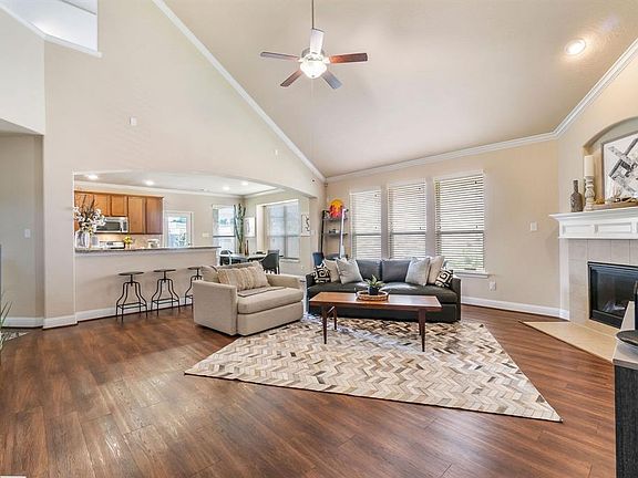 Soaring, vaulted ceiling is the highlight of this 1.5 story home !