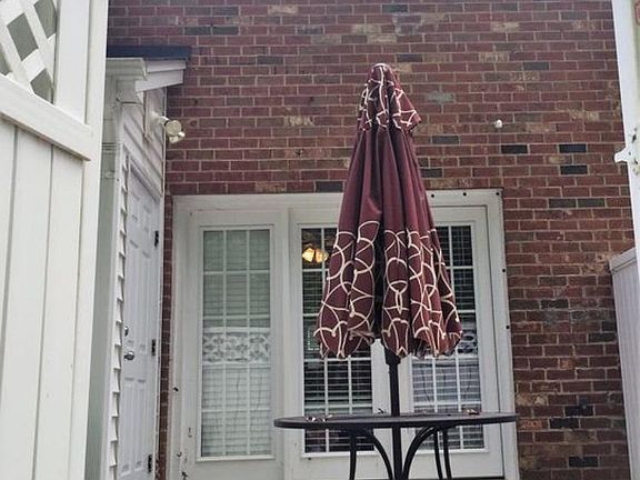 Private patio with secure shed.