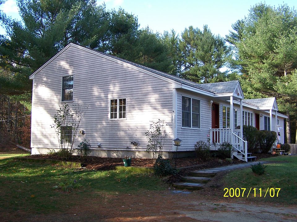 Front and side view of duplex left side is 79 Old Mill Rd, Lee.