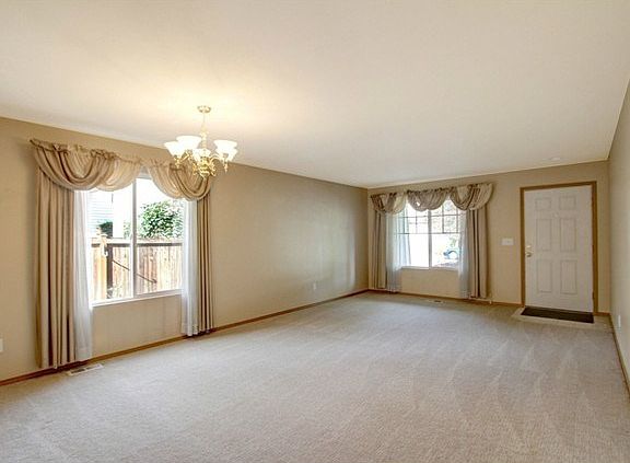 Enter home and your in this spacious living room area with it's