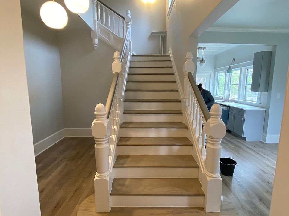 This is the view through front door, left of stairs is an alcove great for a desk or a sitting area. Right of stairs is the living room and open kitchen. Note: this is a wide angle shot and makes the area look bigger.
