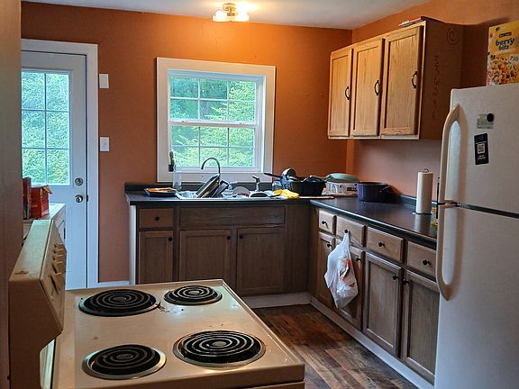 Kitchen also has washer and dryer by back door. 16x12 room size.
