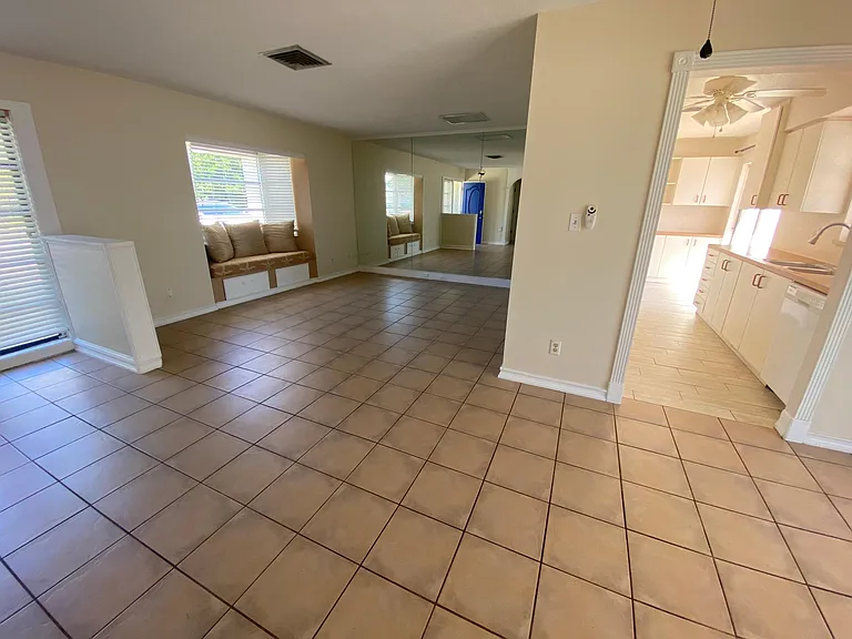 View of living room and kitchen from dining area