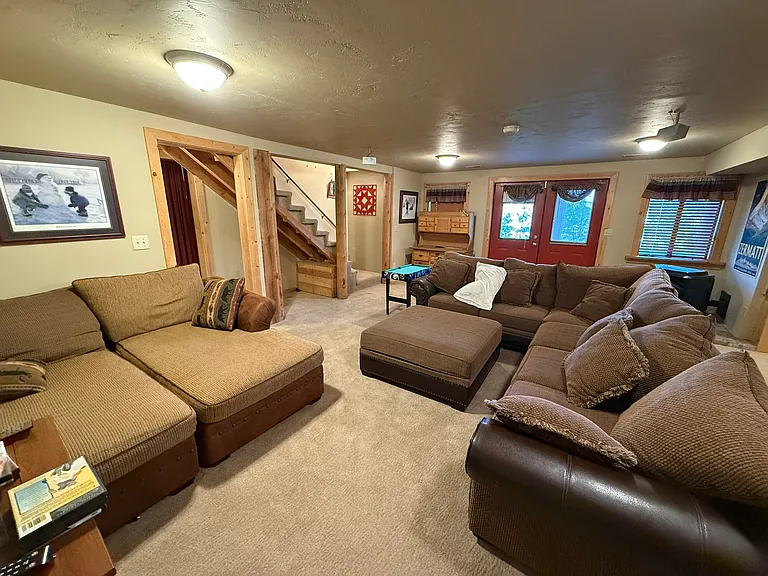 Basement family room, alternate view showing French doors to walkout patio
