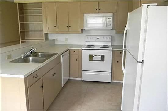 Kitchen has new range, dishwasher, garbage disposal and microwave! Refrigerator to remain!