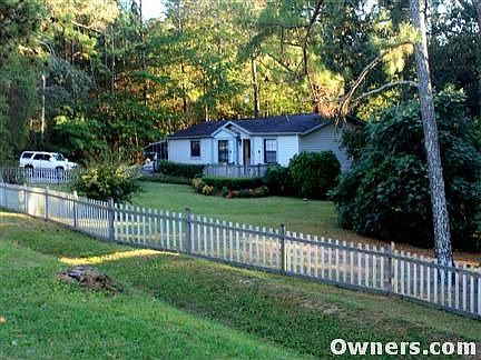 3/4 acre level lot, fenced with woods.