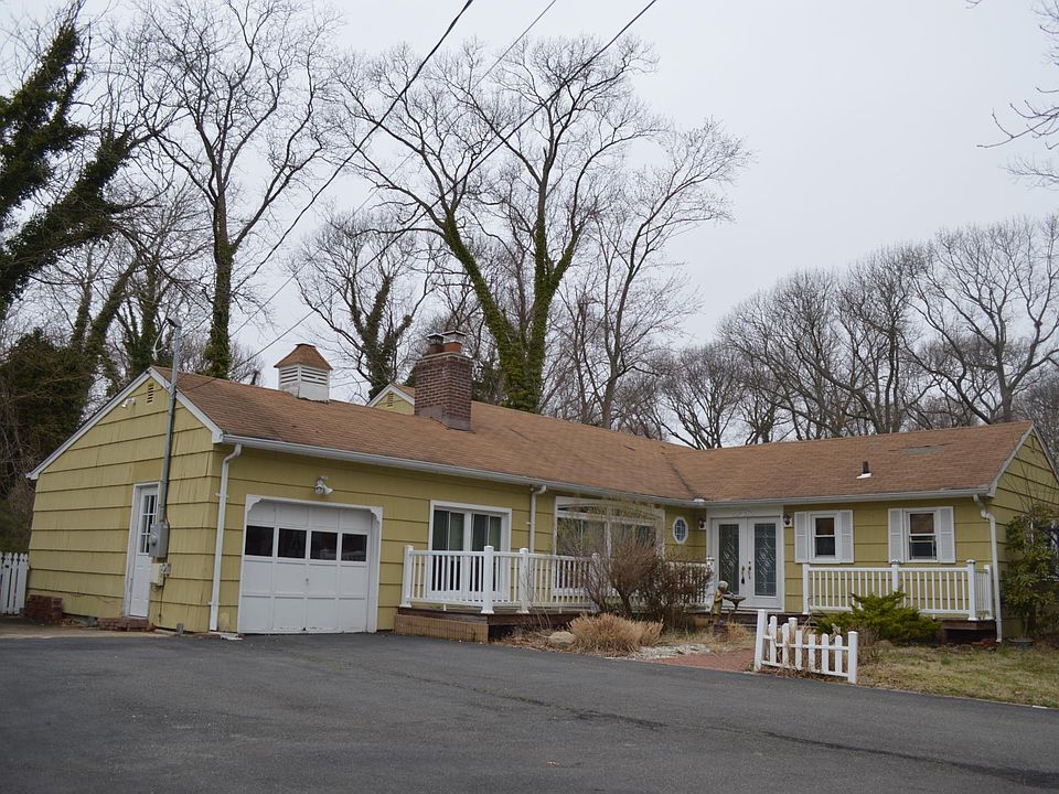 Expaned Ranch house with oversized driveway.