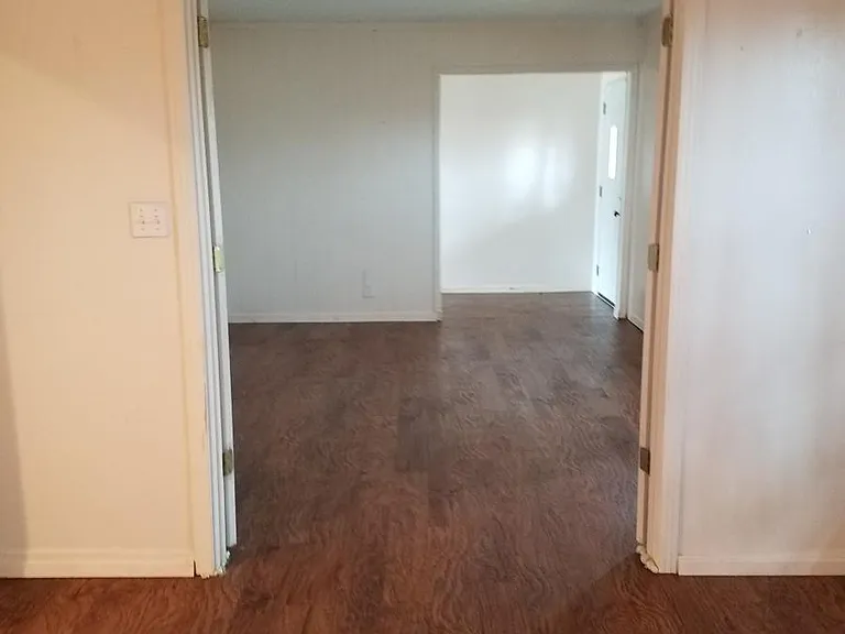 Dining room through french doors into flex room