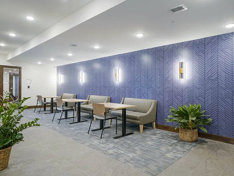 Comfortable lounge seating creates an inviting place to catch up with neighbors or settle in with a quiet moment between the day's routines.