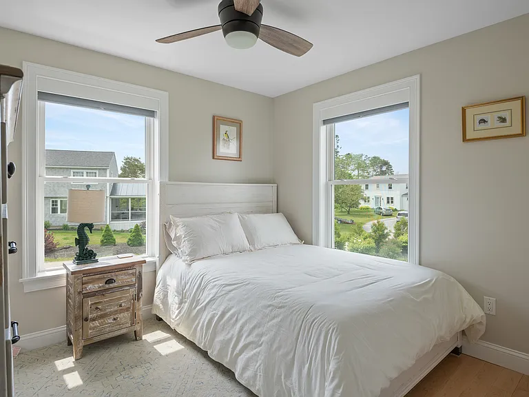 the second floor bedroom two with a full size bed