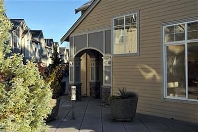 Welcome home! Southwest facing end unit shown in morning light. Two level unit. Courtyard level show