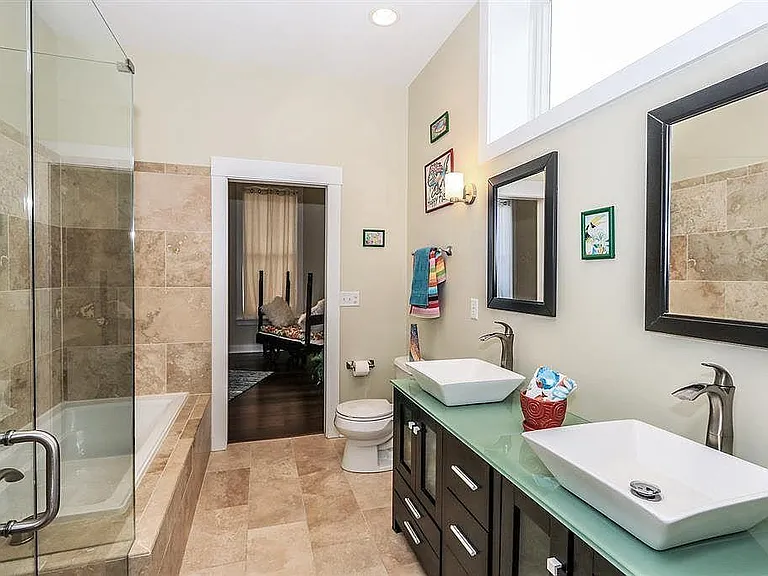 Second Floor main bedroom suite with walk- in shower, tub, double sinks, walk-in closet.