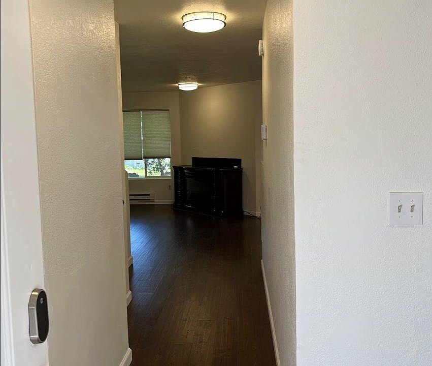 After opening the front door. Not in this photo but turn left for garage/powder room/laundry, turn right for kitchen, and straight ahead for stairs and living room.