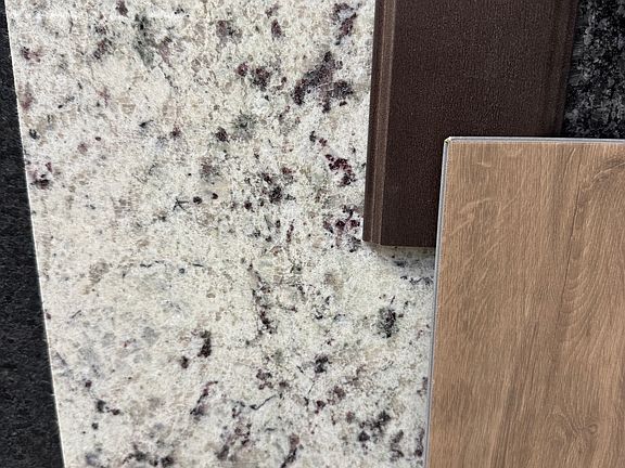Flooring, cabinets and counter tops for the new kitchen.