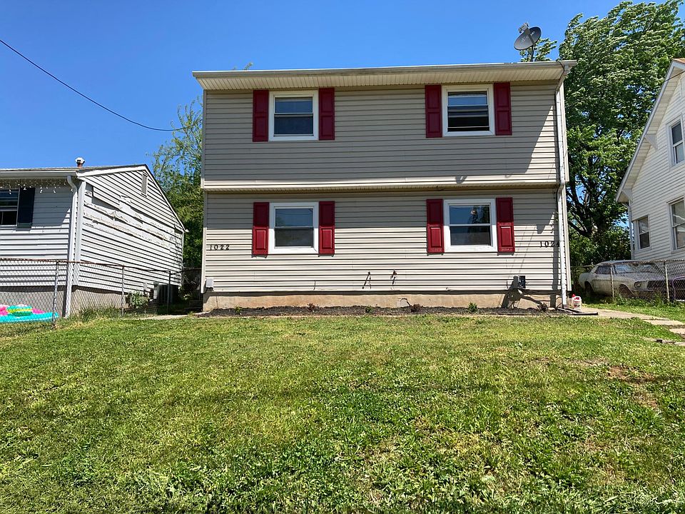 Front of apartment. On-street parking and alley access.