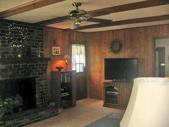 Family Room offers brick raised hearth gas fireplace