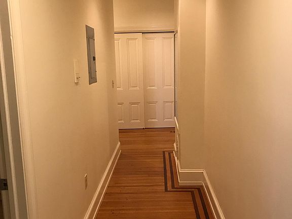 Hallway with hall closet at end