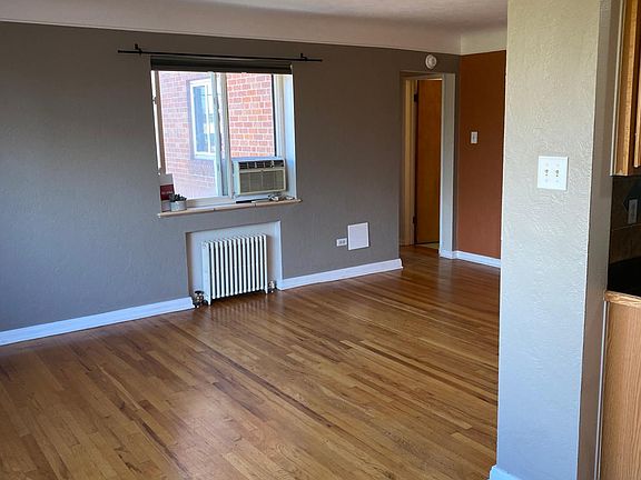 Side East facing window with AC unit in living room area