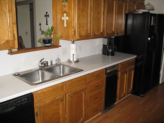Kitchen has open window to view into family room