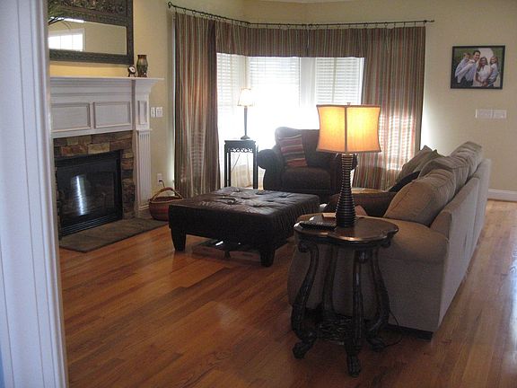 Family room/Den with stone surround gas fireplace