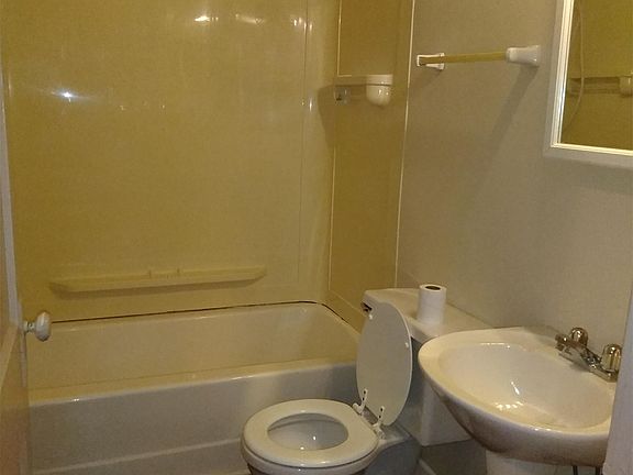 Bathroom has luxury shower head and shaving mirror (not shown)