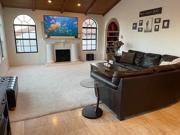 Spacious Living Room with top of the line 4K 70" TV, couches & furniture