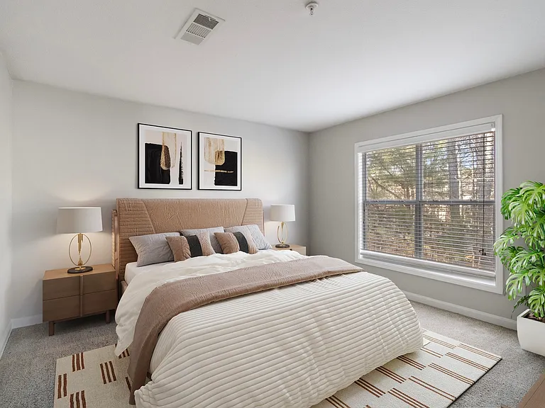 Renovated bedroom with generous space and window light